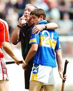 8 July 2007; Referee Pat Casey holding Tipperary's Darragh O'Brien shortly before he issued him with a yellow card. ESB Munster Minor Hurling Championship Final, Cork v Tipperary, Semple Stadium, Thurles, Co. Tipperary. Photo by Sportsfile