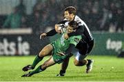 21 November 2014; Ian Porter, Connacht, is tackled by Giulio Bisegni, Zebre. Guinness PRO12, Round 8, Connacht v Zebre. The Sportsground, Galway. Picture credit: Ramsey Cardy / SPORTSFILE