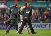 21 November 2014; Paddy Jackson, Ulster, leaves the field with team doctor Micael Webb and Physiotherpist Gareth Robinson in the second half. Guinness PRO12, Round 8, Ulster v Ospreys. Kingspan Stadium, Ravenhill Park, Belfast, Co. Antrim. Picture credit: Oliver McVeigh / SPORTSFILE