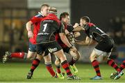 21 November 2014; Cathal Sheridan, Munster, is tackled by Dorian Jones and Brok Harris, Newport Gwent Dragons. Guinness PRO12, Round 8, Newport Gwent Dragons v Munster, Rodney Parade, Newport, Wales. Picture credit: Steve Pope / SPORTSFILE