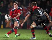 21 November 2014; Ian Keatley, Munster, offloads the ball ahead of the tackle by Lewis Evans, Newport Gwent Dragons. Guinness PRO12, Round 8, Newport Gwent Dragons v Munster, Rodney Parade, Newport, Wales. Picture credit: Steve Pope / SPORTSFILE