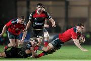 21 November 2014; Robin Copeland, Munster, is tackled by Brook Harris, Newport Gwent Dragons. Guinness PRO12, Round 8, Newport Gwent Dragons v Munster, Rodney Parade, Newport, Wales. Picture credit: Steve Pope / SPORTSFILE