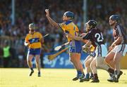 7 July 2007; Gerry O'Grady, Clare, handpasses the slothar away despite the chllenge from Kerrill Wade, Galway. Guinness All-Ireland Senior Hurling Championship Qualifier, Group 1A, Round 2, Clare v Galway, Cusack Park, Ennis, Co. Clare. Picture credit: Brendan Moran / SPORTSFILE