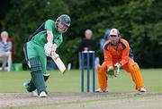 11 July 2007; Eoin Morgan, Ireland, hits a six as Jerome Smits, Netherlands, watches on. Irish Cricket Union, Quadrangular Series, Ireland v Netherlands, Stormont, Belfast, Co. Antrim. Picture credit: Oliver McVeigh / SPORTSFILE
