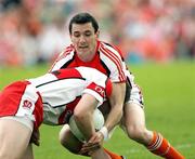 8 July 2007; Andy Mallon, Armagh, in action against Barry McGoldrick, Derry. Bank of Ireland All-Ireland Senior Football Championship Qualifier, Round 1, Armagh v Derry, St Tighearnach's Park, Clones, Co. Monaghan. Picture credit: Oliver McVeigh / SPORTSFILE