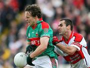 14 July 2007; Andy Moran, Mayo, in action against Sean Martin Lockhart, Derry. Bank of Ireland All-Ireland Football Championship Qualifier, Round 2, Derry v Mayo, Celtic Park, Derry. Picture credit: Oliver McVeigh / SPORTSFILE