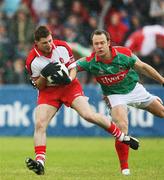 14 July 2007; Gerard O'Kane, Derry, in action against David Brady, Mayo. Bank of Ireland All-Ireland Football Championship Qualifier, Round 2, Derry v Mayo, Celtic Park, Derry. Picture credit: Oliver McVeigh / SPORTSFILE