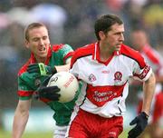 14 July 2007; Enda Muldoon, Derry, in action against David Heaney, Mayo. Bank of Ireland All-Ireland Football Championship Qualifier, Round 2, Derry v Mayo, Celtic Park, Derry. Picture credit: Oliver McVeigh / SPORTSFILE