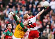 14 July 2007; Colin Devlin, Derry, gets his hand to the ball ahead of David Clarke, Mayo, for his side's first goal. Bank of Ireland All-Ireland Football Championship Qualifier, Round 2, Derry v Mayo, Celtic Park, Derry. Picture credit: Oliver McVeigh / SPORTSFILE