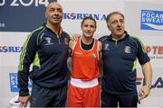 23 November 2014; Katie Taylor, Ireland, celebrates after beating Junhua Yin, China, in her semi-final bout with coaches Pete Taylor, left, and Zaur Antia. 2014 AIBA Elite Women's World Boxing Championships, Jeju, Korea. Photo by Sportsfile