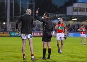 23 November 2014; Garrycastle goalkeeper Cathal Mullin receives a black card from referee John Hickey. AIB Leinster GAA Football Senior Club Championship Semi-Final, St Vincent's v Garrycastle. Parnell Park, Dublin. Picture credit: Stephen McCarthy / SPORTSFILE