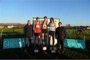 23 November 2014; Race winner Paul Pollock, Antrim, centre, second placed Mark Hanrahan, Cork, second left, and third placed Michael Clohisey, Dublin, Jim Dowdall, CEO of GloHealth, and John Foley, CEO of Athletics Ireland, on the podium after the Senior Mens 10,000m race at the GloHealth Inter County & Juvenile Even Age Cross Country Championships. Dundalk Institute of Technology, Dundalk, Co. Louth. Picture credit: Ramsey Cardy / SPORTSFILE