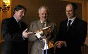 23 March 2004; President of the FAI Milo Corcoran with FAI Chief Executive Fran Rooney, left, and UEFA General Secretary Lars Christian Olsen  at the Statoil FAI Junior Cup Semi-Final draw at the Four Seasons Hotel in Ballsbridge, Dublin. Photo by Pat Murphy/Sportsfile
