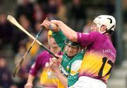28 March 2004; Rory Hanniffy of Offaly is tackled by David O'Connor of Wexford during the Allianz Hurling League Division 1B match between Offaly and Wexford at St. Brendan's Park in Birr, Offaly. Photo by David Maher/Sportsfile