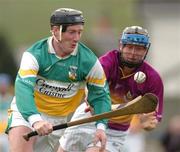 28 March 2004; Brian Whelahan of Offaly in action against M.J. Furlong of Wexford during the Allianz Hurling League Division 1B match between Offaly and Wexford at St. Brendan's Park in Birr, Offaly. Photo by David Maher/Sportsfile