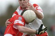 28 March 2004; Graham Canty of Cork is tackled by Owen Mulligan of Tyrone during the Allianz Football League Division 1A match between Tyrone and Cork at Healy Park in Omagh, Tyrone. Photo by Ray McManus/Sportsfile