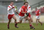 28 March 2004; Alan Cronin of Cork in action against Stephen O'Neill and Philip Jordan, left, of Tyrone during the Allianz Football League Division 1A match between Tyrone and Cork at Healy Park in Omagh, Tyrone. Photo by Ray McManus/Sportsfile