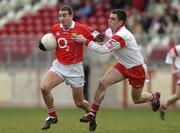 28 March 2004; Colin Crowley of Cork in action against Ryan McMenamin of Tyrone during the Allianz Football League Division 1A match between Tyrone and Cork at Healy Park in Omagh, Tyrone. Photo by Ray McManus/Sportsfile