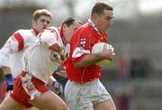 28 March 2004; Eoin Sexton of Cork in action against Brian Dooher of Tyrone during the Allianz Football League Division 1A match between Tyrone and Cork at Healy Park in Omagh, Tyrone. Photo by Ray McManus/Sportsfile
