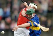 28 March 2004; Declan Fanning of Tipperary in action against Niall McCarthy of Cork during the Allianz Hurling League Division 1B match between Cork and Tipperary at Pairc Ui Chaoimh in Cork. Photo by Brendan Moran/Sportsfile