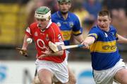 28 March 2004; Niall McCarthy of Cork in action against John Carroll of Tipperary during the Allianz Hurling League Division 1B match between Cork and Tipperary at Pairc Ui Chaoimh in Cork. Photo by Brendan Moran/Sportsfile