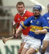 28 March 2004; Paddy O'Brien of Tipperary in action against Diarmuid O'Sullivan of Cork during the Allianz Hurling League Division 1B match between Cork and Tipperary at Pairc Ui Chaoimh in Cork. Photo by Brendan Moran/Sportsfile