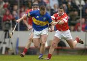 28 March 2004; John Carroll of Tipperary in action against John Gardiner, left, and Mark Prendergast of Cork during the Allianz Hurling League Division 1B match between Cork and Tipperary at Pairc Ui Chaoimh in Cork. Photo by Brendan Moran/Sportsfile
