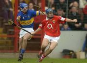 28 March 2004; Kieran Murphy of Cork in action against Colin Morrissey of Tipperary during the Allianz Hurling League Division 1B match between Cork and Tipperary at Pairc Ui Chaoimh in Cork. Photo by Brendan Moran/Sportsfile