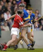 28 March 2004; John Gardiner of Cork in action against Mark O'Leary of Tipperary during the Allianz Hurling League Division 1B match between Cork and Tipperary at Pairc Ui Chaoimh in Cork. Photo by Brendan Moran/Sportsfile