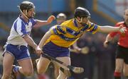 28 March 2004; Frank Lohan of Clare in action against Tony Browne of Waterford during the Allianz Hurling League match between Clare and Waterford at Cusack Park in Ennis, Clare. Photo by Damien Eagers/Sportsfile