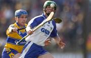 28 March 2004; David O'Brien of Waterford in action against Andrew Quinn of Clare during the Allianz Hurling League match between Clare and Waterford at Cusack Park in Ennis, Clare. Photo by Damien Eagers/Sportsfile