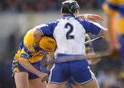 28 March 2004; Tom Feeney of Waterford in action against Tony Griffin of Clare during the Allianz Hurling League match between Clare and Waterford at Cusack Park in Ennis, Clare. Photo by Damien Eagers/Sportsfile