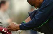 29 March 2004; Clinton Morrison adjusts his boots during a Republic of Ireland Training Session at the Carlisle Grounds in Bray, Wicklow. Photo by David Maher/Sportsfile