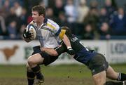 2 April 2004; Gordon D'Arcy of Leinster Lions is tackled by Graeme Beveridge of Glasgow Rugby during the Celtic League Division 1 match between Leinster Lions and Glasgow Rugby at Donnybrook Stadium in Dublin. Photo by Matt Browne/Sportsfile