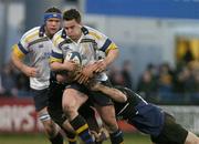 2 April 2004; Gary Brown of Leinster Lions is tackled by Graeme Beveridge, right, and Daniel Parks of Glasgow Rugby during the Celtic League Division 1 match between Leinster Lions and Glasgow Rugby at Donnybrook Stadium in Dublin. Photo by Matt Browne/Sportsfile