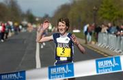 3 April 2004; Catherina McKiernan crosses the line to become the first placed female finisher during the BUPA Great Ireland Run at the Phoenix Park in Dublin. Photo by Ray McManus/Sportsfile