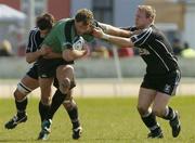 3 April 2004; Matt Mostyn of Connacht is tackled by Barry Williams and James Bater of Neath Swansea during the Celtic League Division 1 match between Connacht and Neath Swansea at the Sportsground in Galway. Photo by Matt Browne/Sportsfile