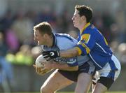4 April 2004; Comann Goggins of Dublin in action against Jamesie Martin of Longford during the Allianz Football League Division 1A Round 7 match between Dublin and Longford at Parnell Park in Dublin. Photo by Pat Murphy/Sportsfile
