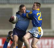 4 April 2004; Ciaran Whelan of Dublin is tackled by John Kenny of Longford during the Allianz Football League Division 1A Round 7 match between Dublin and Longford at Parnell Park in Dublin. Photo by Pat Murphy/Sportsfile