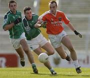 4 April 2004; Malachy Mackin of Armagh in action against  Stephen Lucey of Limerick during the Allianz Football League Division 1B Round 7 match between Limerick and Armagh at the Gaelic Grounds in Limerick. Photo by David Maher/Sportsfile