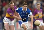 4 April 2004; Kevin Fitzpatrick of Laois in action against Nicky Lambert of Wexford during the Allianz Football League Division 1B Round 7 match between Laois and Wexford at O'Moore Park in Portlaoise, Laois. Photo by Damien Eagers/Sportsfile