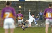 4 April 2004; Matty Forde of Wexford shoots a penalty past Laois goalkeeper Michael Nolan to score his side's first goal during the Allianz Football League Division 1B Round 7 match between Laois and Wexford at O'Moore Park in Portlaoise, Laois. Photo by Damien Eagers/Sportsfile