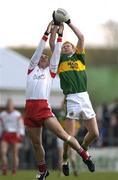 4 April 2004; Colin Holmes of Tyrone in action against Seamus Scanlon of Kerry during the Allianz Football League Division 1A Round 7 match between Tyrone and Kerry at Healy Park in Omagh, Tyrone. Photo by Brendan Moran/Sportsfile
