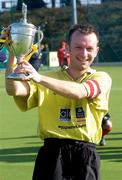 4 April 2004; Instonians captain Mark Wainwright lifts the cup following the Men's Hockey Irish Senior Cup Final match between Cork Harlequins and Instonians at Belfield in Dublin. Photo by Brian Lawless/Sportsfile