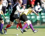 4 April 2004; Mark Irwin of Instonians in action against Jason Black of Cork Harlequins during the Men's Hockey Irish Senior Cup Final match between Cork Harlequins and Instonians at Belfield in Dublin. Photo by Brian Lawless/Sportsfile