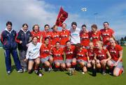 4 April 2004; The Pegasus team and management celebrate with the cup following the Women's Hockey Irish Senior Cup Final match between Hermes and Pegasus at Belfield in Dublin. Photo by Brian Lawless/Sportsfile