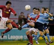 9 April 2004; Ray Scully of Dublin City in action against Stuart Byrne, left, and Ollie Cahill of Shelbourne during the Eircom League Premier Division match between Shelbourne and Dublin City at Tolka Park in Dublin. Photo by David Maher/Sportsfile