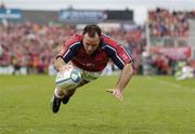 10 April 2004; Mike Mullins of Munster goes over to score his side's third try during the Heineken Cup Quarter-Final match between Munster and Stade Francais at Thomond Park in Limerick. Photo by Ray McManus/Sportsfile