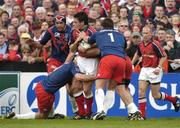 10 April 2004; David Wallace of Munster in action against Sylvain Marconnet, 1, of Stade Francais during the Heineken Cup Quarter-Final match between Munster and Stade Francais at Thomond Park in Limerick. Photo by Brendan Moran/Sportsfile