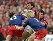 10 April 2004; Rob Henderson of Munster, supported by team-mate David Wallace, in action against Brian Liebenberg, 12, and Remy Martin of Stade Francais during the Heineken Cup Quarter-Final match between Munster and Stade Francais at Thomond Park in Limerick. Photo by Brendan Moran/Sportsfile